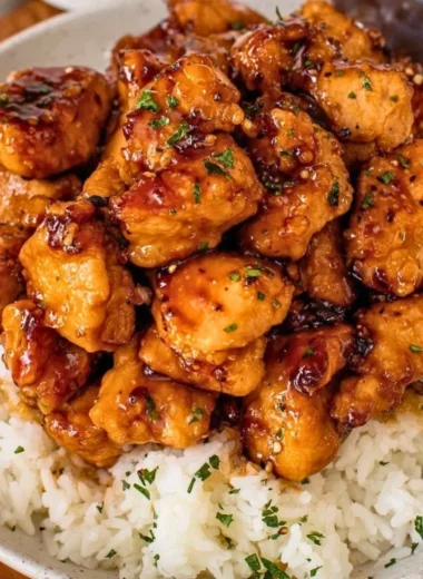 20-minute honey garlic chicken bites on a plate garnished with green onions.