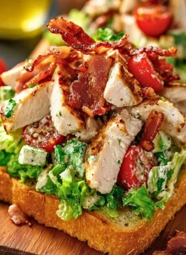 BLT Chicken Salad with bacon, chicken, lettuce, and tomatoes in a bowl