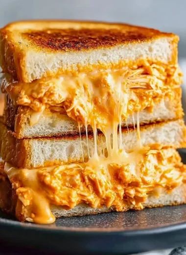Buffalo Chicken Grilled Cheese Sandwich with melted cheese and spicy buffalo sauce
