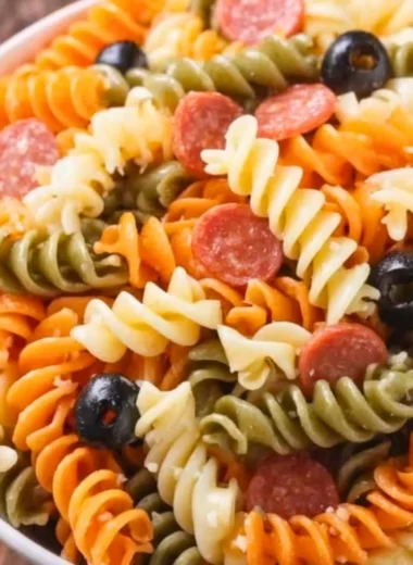 Bowl of easy and delicious Italian pasta salad with fresh vegetables and dressing