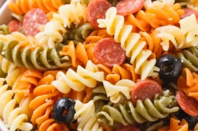 Bowl of easy and delicious Italian pasta salad with fresh vegetables and dressing
