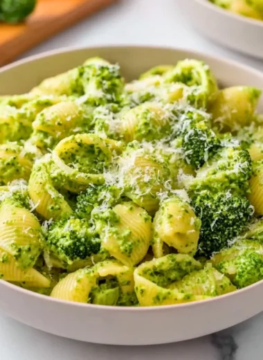Healthy broccoli pasta dish with fresh vegetables and a savory sauce