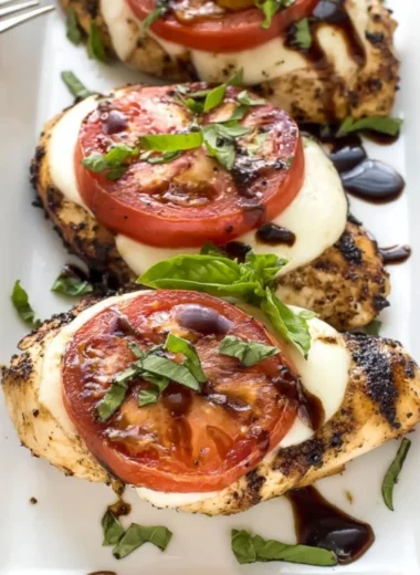 Delicious Grilled Chicken Caprese with basil and mozzarella on a plate