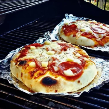 Delicious grilled pizza with colorful toppings on a wooden board