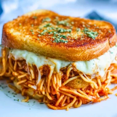 Spaghetti grilled cheese sandwich with melty cheese and pasta filling
