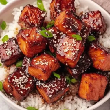 Honey Garlic Salmon Bites Bowl garnished with vegetables in a serving dish
