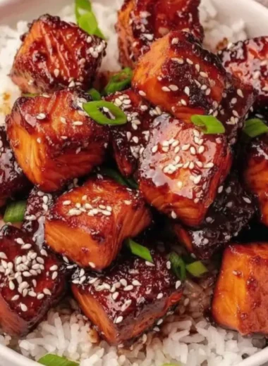 Honey Garlic Salmon Bites Bowl garnished with vegetables in a serving dish