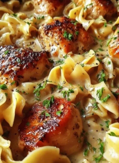Delicious one-pan creamy garlic butter chicken served over egg noodles