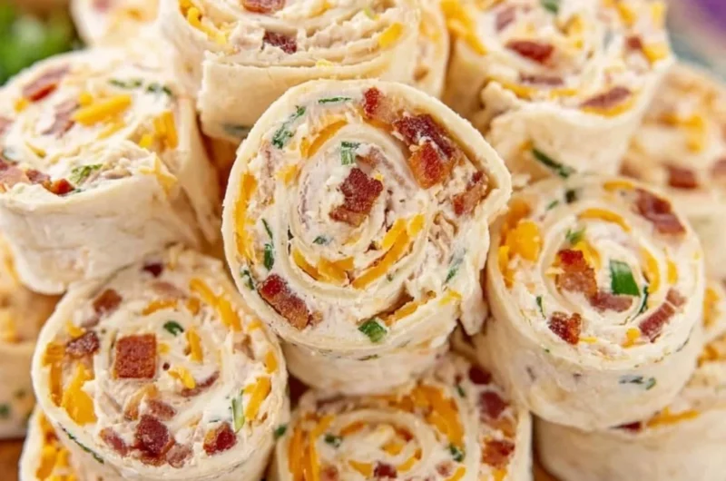 Colorful potluck pinwheels arranged on a platter for a party.