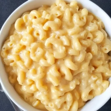 Bowl of simple mac and cheese with creamy cheese sauce and pasta