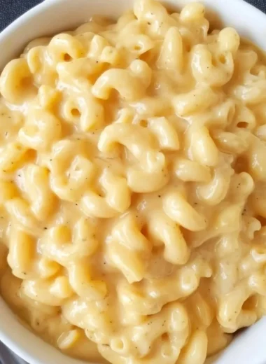 Bowl of simple mac and cheese with creamy cheese sauce and pasta