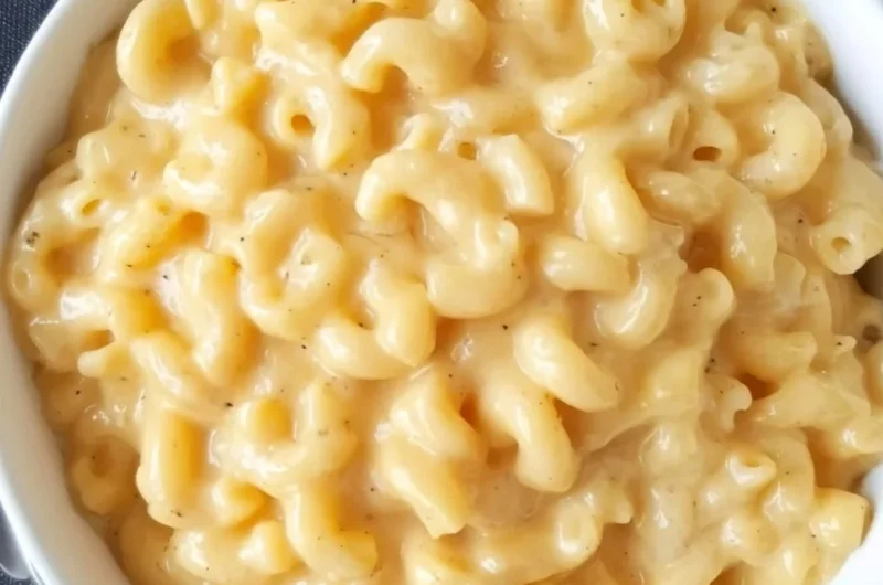 Bowl of simple mac and cheese with creamy cheese sauce and pasta