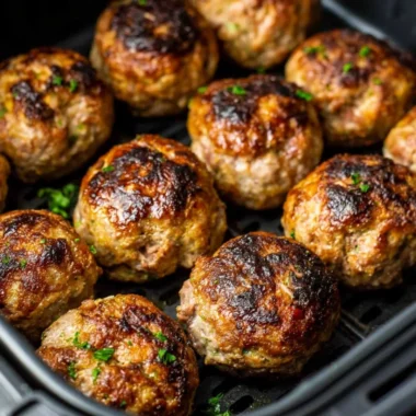 Delicious air fryer meatballs served on a plate with garnish