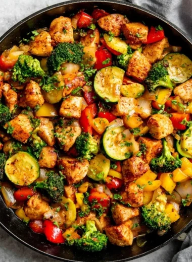Chicken and vegetables skillet dish served in a cast iron pan
