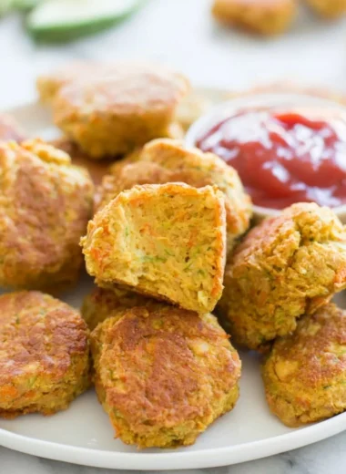 Plate of crispy chickpea nuggets served with dipping sauce