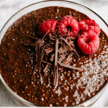 Rich Chocolate Chia Seed Pudding in a bowl garnished with strawberries