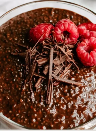 Rich Chocolate Chia Seed Pudding in a bowl garnished with strawberries