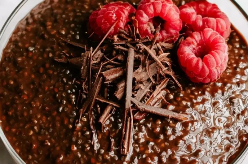 Rich Chocolate Chia Seed Pudding in a bowl garnished with strawberries