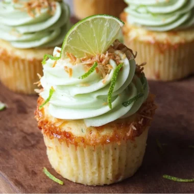 Coconut Cupcakes with Lime Buttercream Frosting on a decorative plate