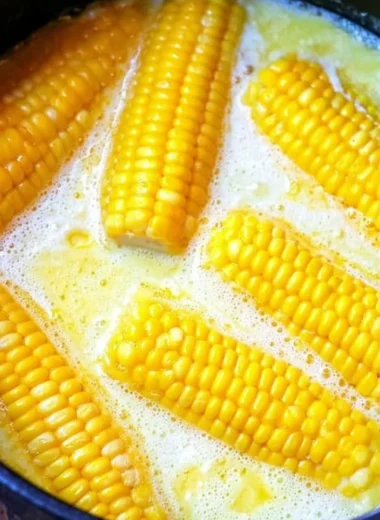 Freshly grilled corn on the cob ready to be served with butter and seasonings.