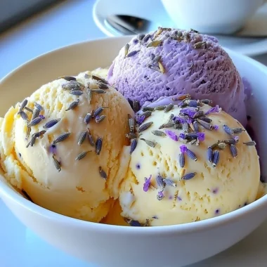 Creamy lavender honey ice cream in a bowl with lavender sprigs