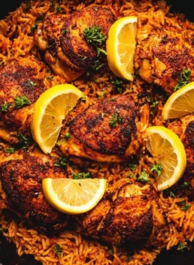 One Pan Spanish Chicken and Rice with vibrant ingredients in a skillet