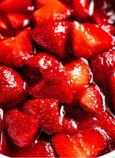 Homemade fresh strawberry sauce drizzled over pancakes.
