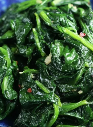 Delicious quick and easy sautéed spinach cooked with garlic and olive oil.
