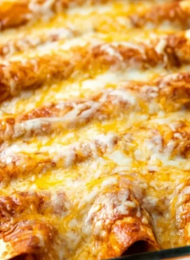 Delicious restaurant-style red cheese enchiladas topped with spicy red sauce and melted cheese.
