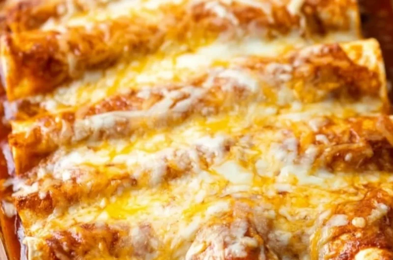 Delicious restaurant-style red cheese enchiladas topped with spicy red sauce and melted cheese.