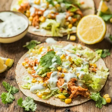 Skinny Buffalo Chicken Tacos served with fresh toppings