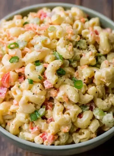 Delicious small homemade macaroni salad in a bowl with fresh ingredients