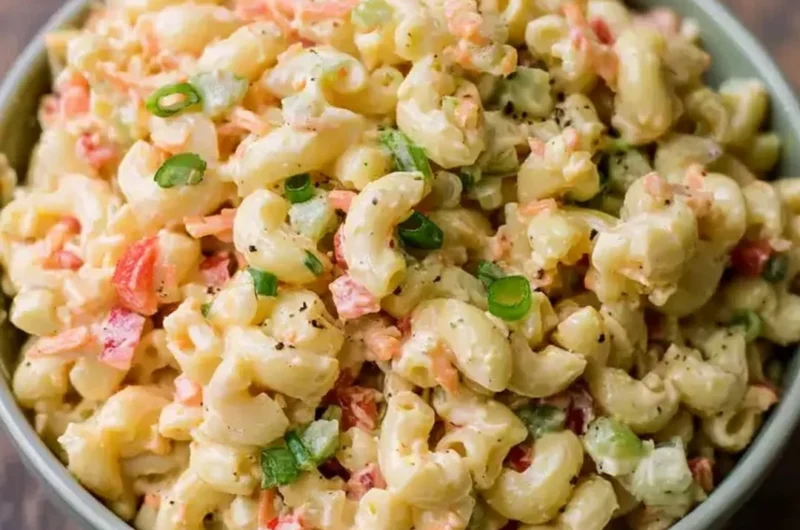 Delicious small homemade macaroni salad in a bowl with fresh ingredients