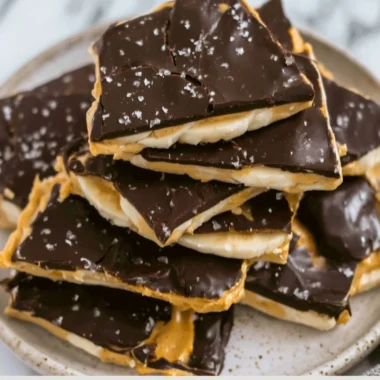 Delicious homemade banana bark snack with toppings on a plate