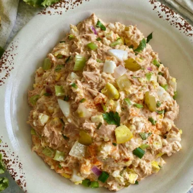 Delicious bowl of best ever tuna salad with eggs and fresh ingredients