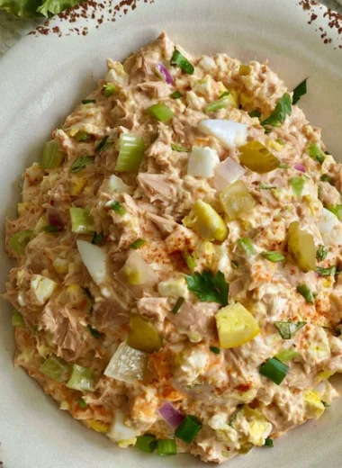 Delicious bowl of best ever tuna salad with eggs and fresh ingredients