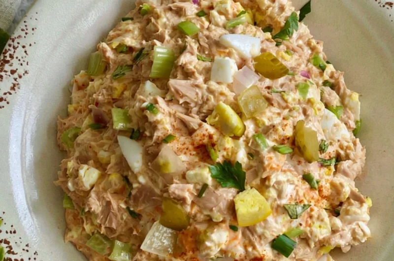 Delicious bowl of best ever tuna salad with eggs and fresh ingredients