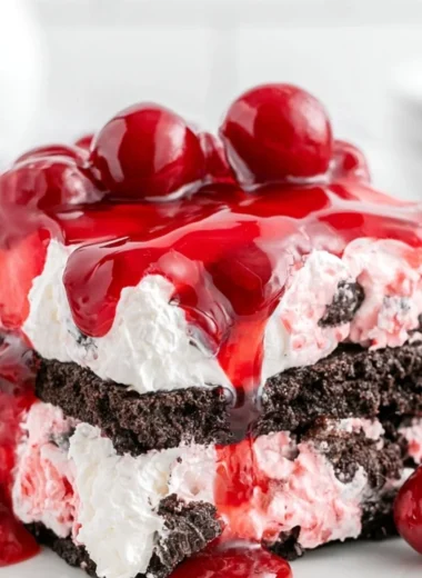 Delicious Black Forest Icebox Cake with layers of chocolate, cherries, and whipped cream
