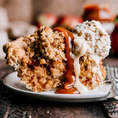 Slice of Dutch Caramel Apple Pie with warm caramel drizzle