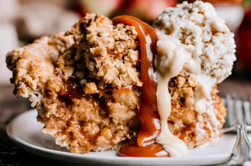 Slice of Dutch Caramel Apple Pie with warm caramel drizzle