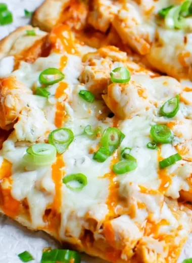High protein buffalo chicken flatbread topped with fresh ingredients