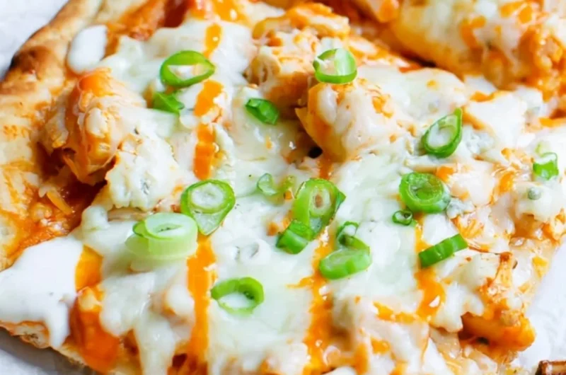 High protein buffalo chicken flatbread topped with fresh ingredients