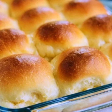 Freshly baked old-fashioned yeast rolls on a wooden table