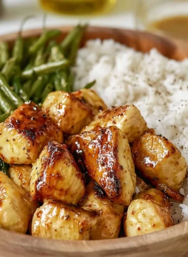 Delicious honey mustard chicken bowl served with fresh vegetables and grains