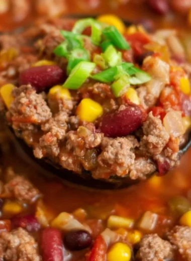 Bowl of Santa Fe Taco Soup topped with cheese and cilantro