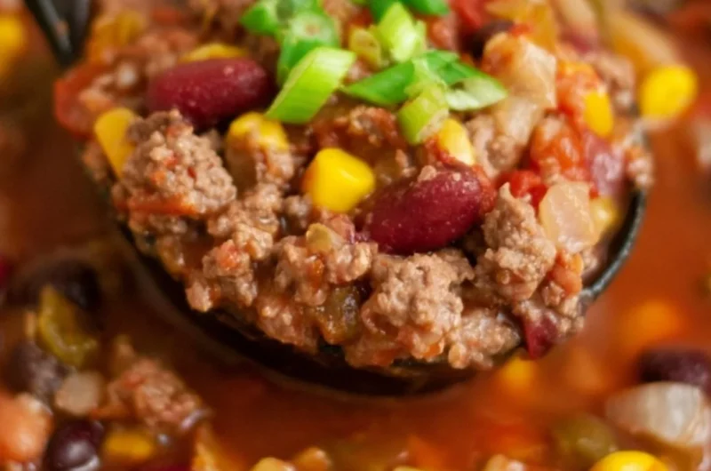 Bowl of Santa Fe Taco Soup topped with cheese and cilantro