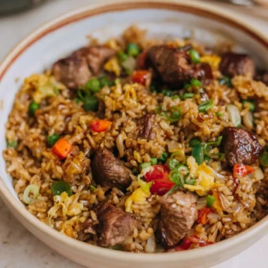 Delicious plate of Steak Fried Rice with tender beef and colorful vegetables