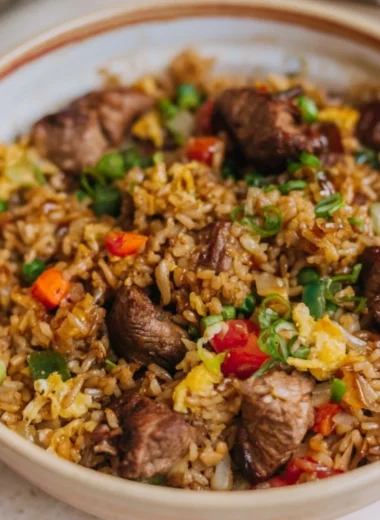 Delicious plate of Steak Fried Rice with tender beef and colorful vegetables
