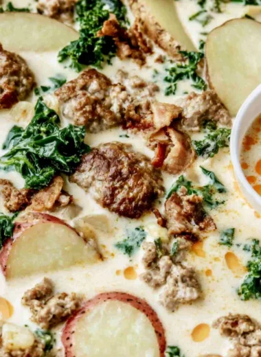 Bowl of hearty Tuscany Soup with fresh vegetables and herbs