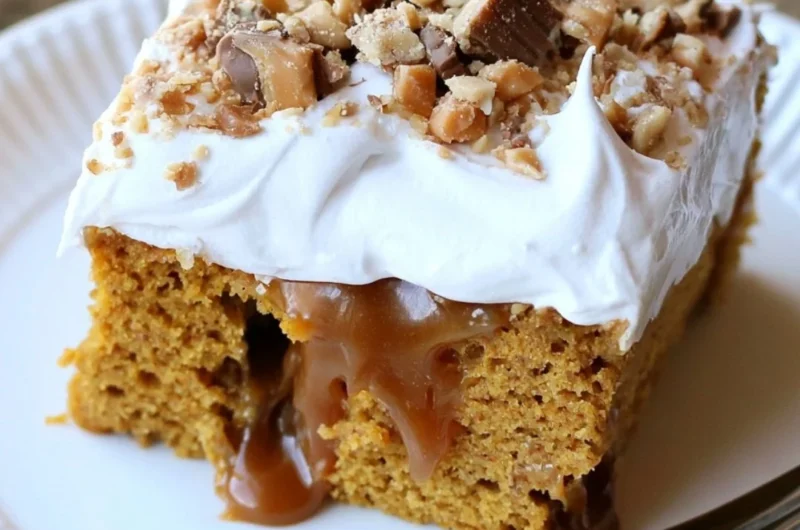 Delicious Caramel Pumpkin Poke Cake topped with creamy caramel sauce and whipped cream.